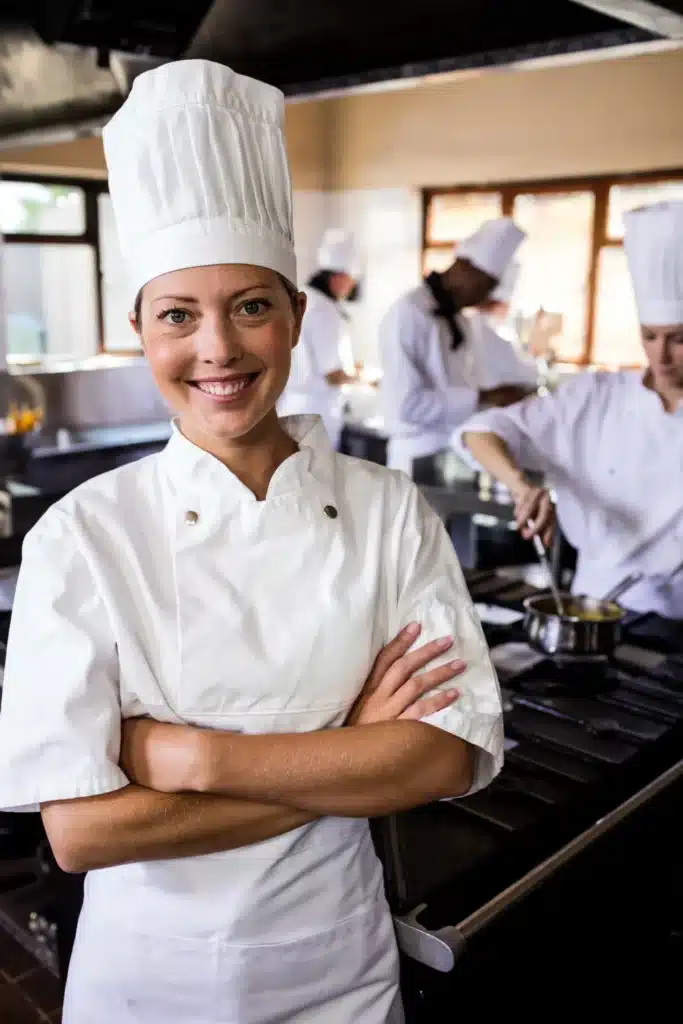 About About female chef standing with arms crossed in kitchen 2025 04 03 03 43 41 utc1 scaled